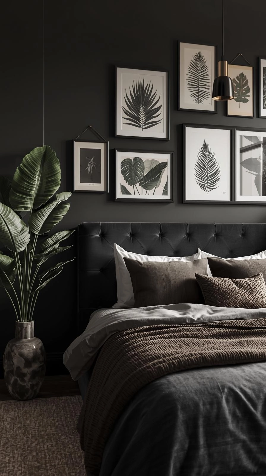 Dark botanical bedroom with framed fern sketches, tropical art, and black-and-white botanical prints styled above the bed.